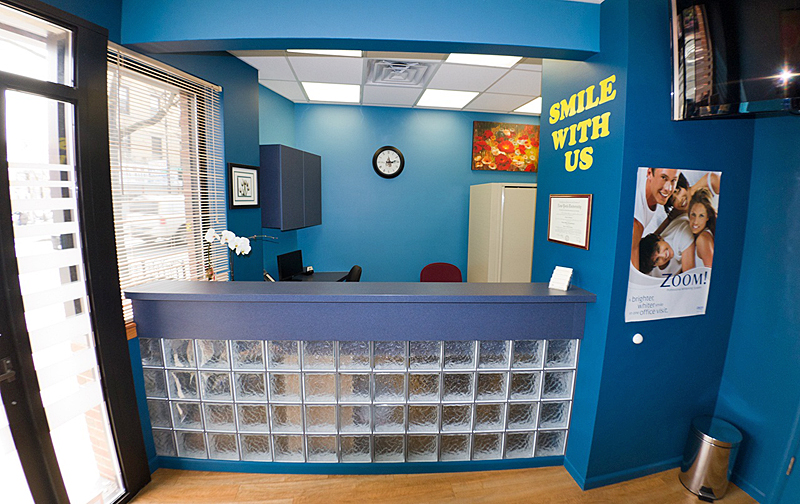 Reception with blue walls and the words Smile with us
